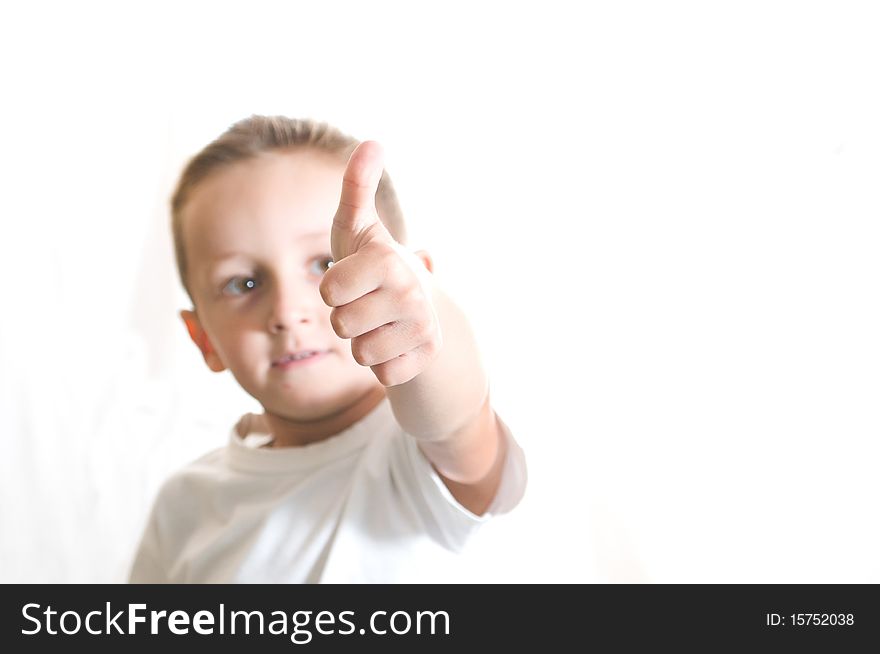 Little cute boy giving ok isolated over white background. Little cute boy giving ok isolated over white background