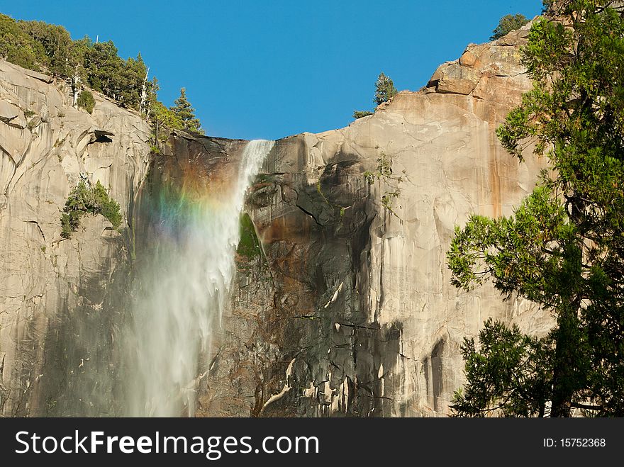 Rainbow in Bridalveil Falls at sunset in Yosemite National Park. Rainbow in Bridalveil Falls at sunset in Yosemite National Park