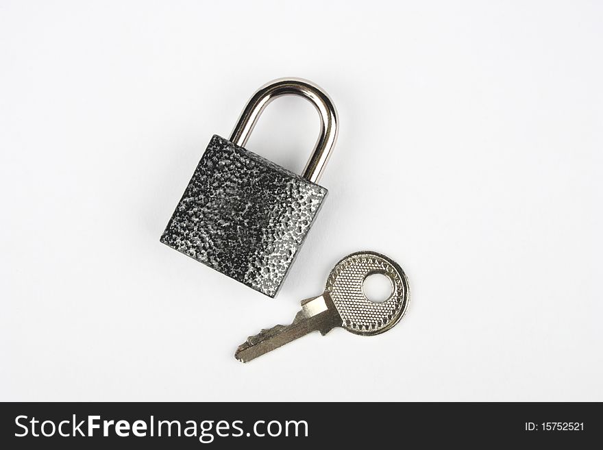 Top view of a closed Lock with its key. Top view of a closed Lock with its key