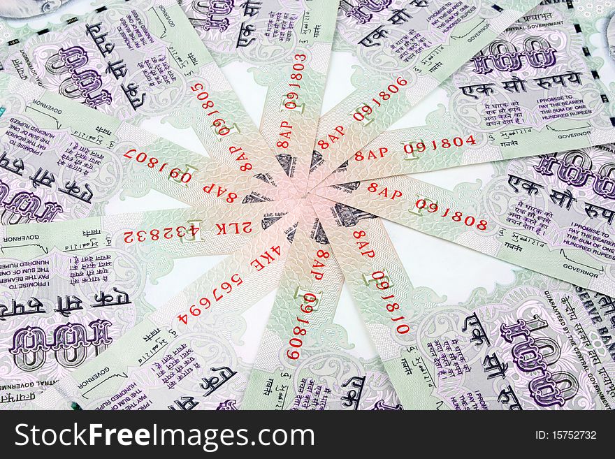 Indian currency 100 rupee notes in a circular manner. Indian currency 100 rupee notes in a circular manner