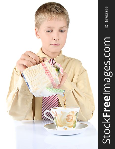 Portrait of young teenager drinking tea. Is isolated on a white background.