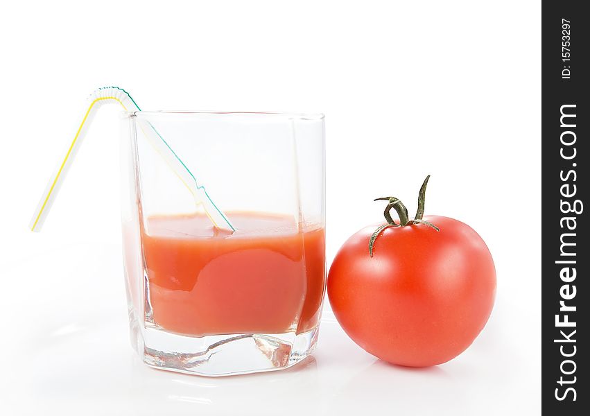 Tomato juice in glass over white