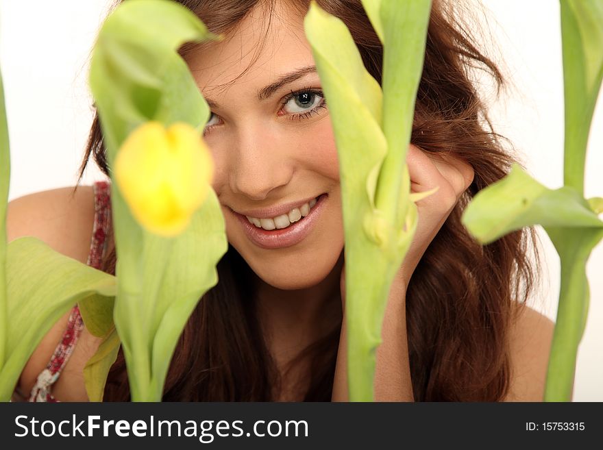 Young brunette woman with yellow flowers. Young brunette woman with yellow flowers