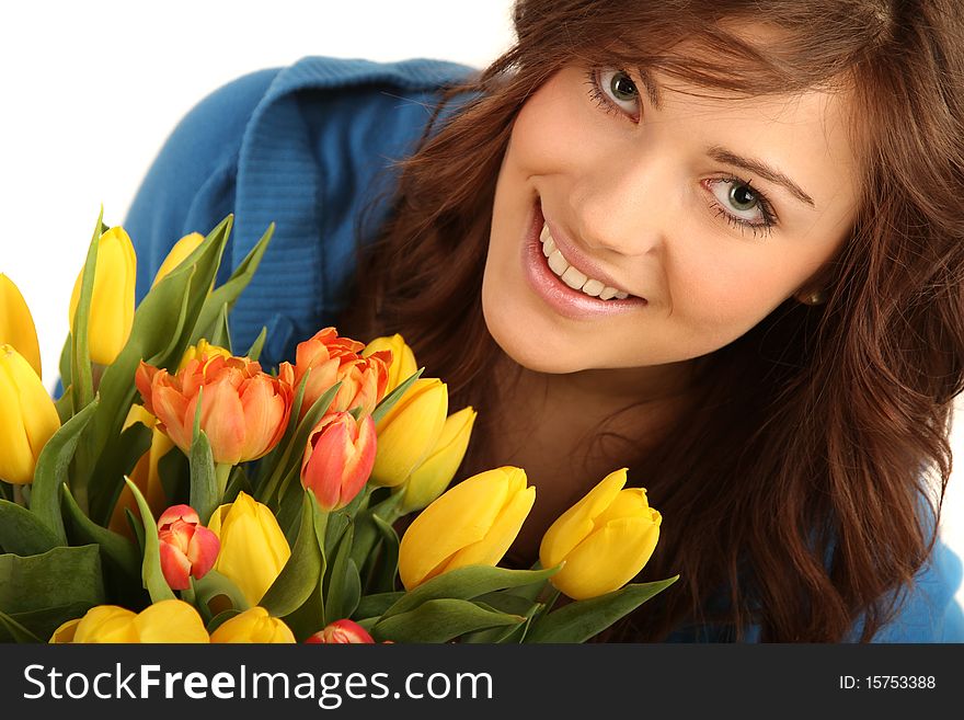 Young brunette woman with yellow and red flowers. Young brunette woman with yellow and red flowers
