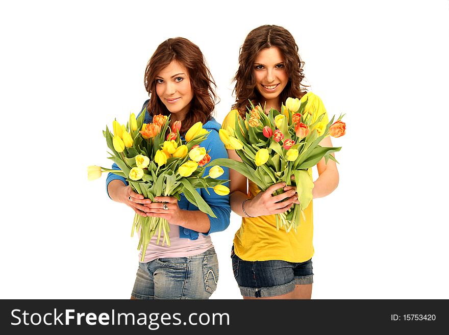 Two girls holding a bouquet. Two girls holding a bouquet