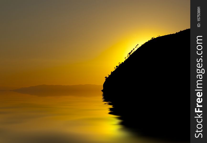 An orange and yellow sunset over a calm sea. An orange and yellow sunset over a calm sea