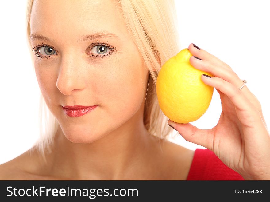 Young blond woman showing a citron. Young blond woman showing a citron