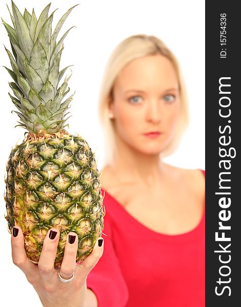 Young blond woman showing a Pineapple. Young blond woman showing a Pineapple