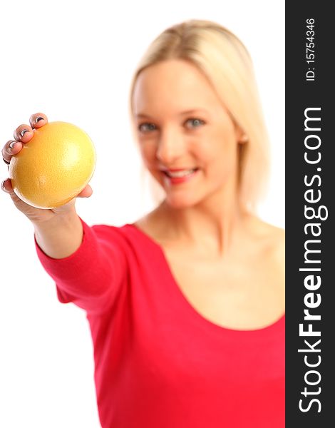 Young blond woman showing a grapefruit. Young blond woman showing a grapefruit