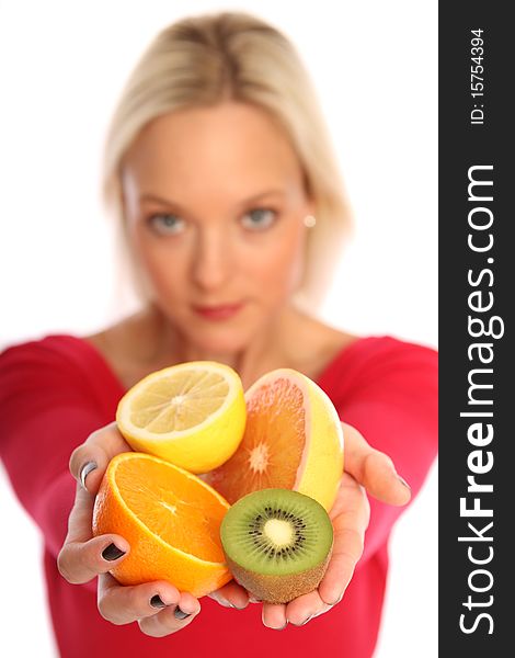 Beautiful young woman holding four half's of fresh fruits. Beautiful young woman holding four half's of fresh fruits