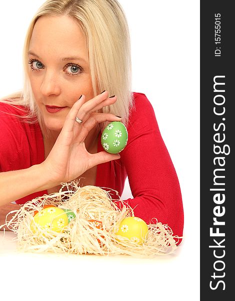 Beautiful blond woman laying on the floor with some easter eggs. Beautiful blond woman laying on the floor with some easter eggs