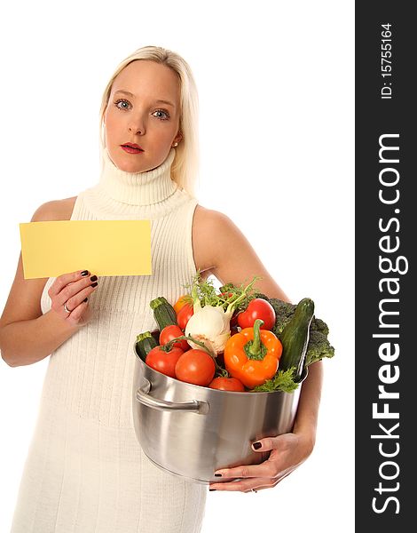 Young blond woman holding some different fresh vegetables and a yellow sign. Young blond woman holding some different fresh vegetables and a yellow sign