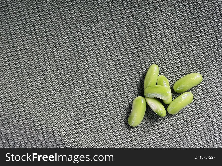 Green beans of the French string bean against from a fabric.