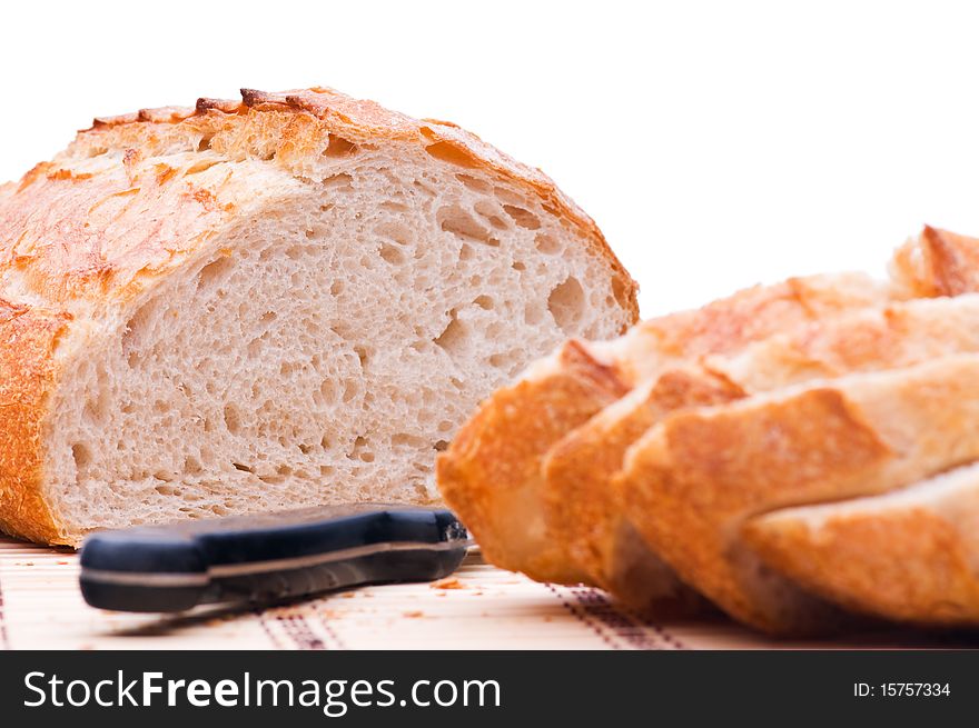 Sliced wheat bread on white background
