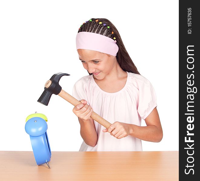 Little girl breaking an alarm clock isolated on white background