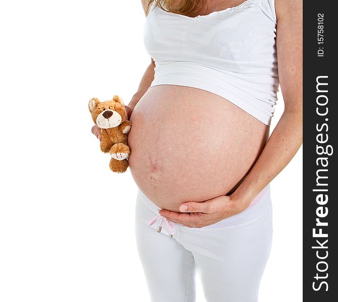 Young fresh pregnant woman with baby toys. Isolated over white background. Young fresh pregnant woman with baby toys. Isolated over white background.