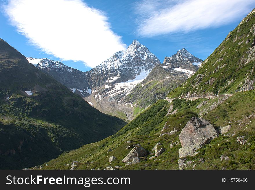 Green Swiss mountains with clouds. Green Swiss mountains with clouds