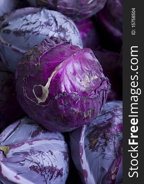 Lots of purple cabbages in a pile. Lots of purple cabbages in a pile