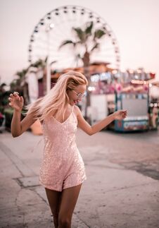 Beautiful Hipster Girl Happy Posing At The Ferris Wheel Near Agia Napa Amusement Park Carousel Royalty Free Stock Image