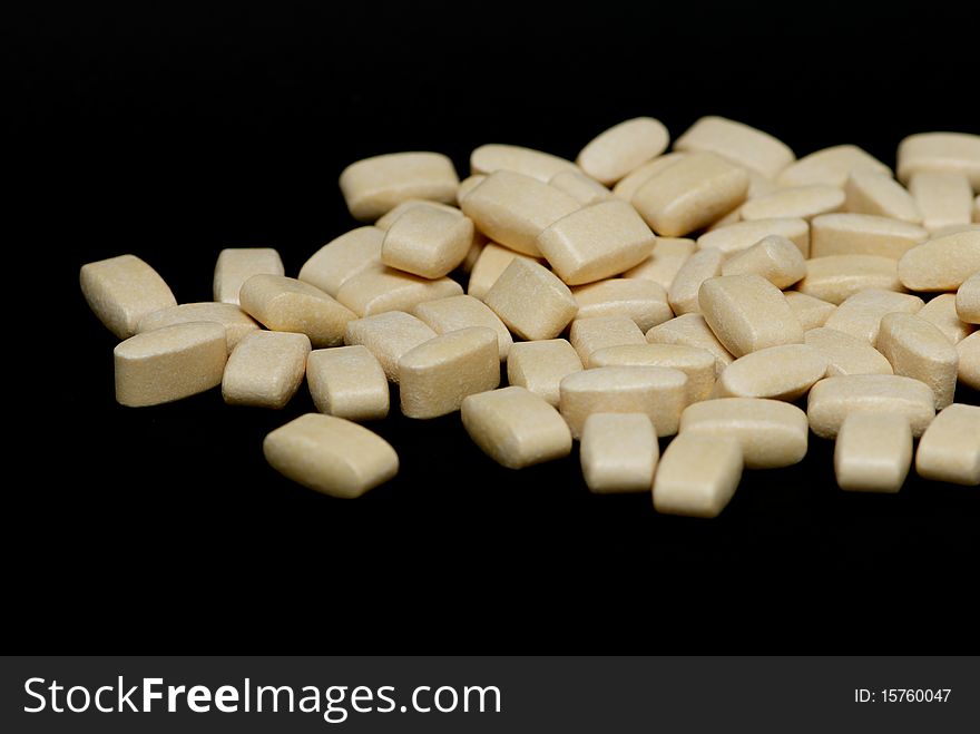 Pills on a black background