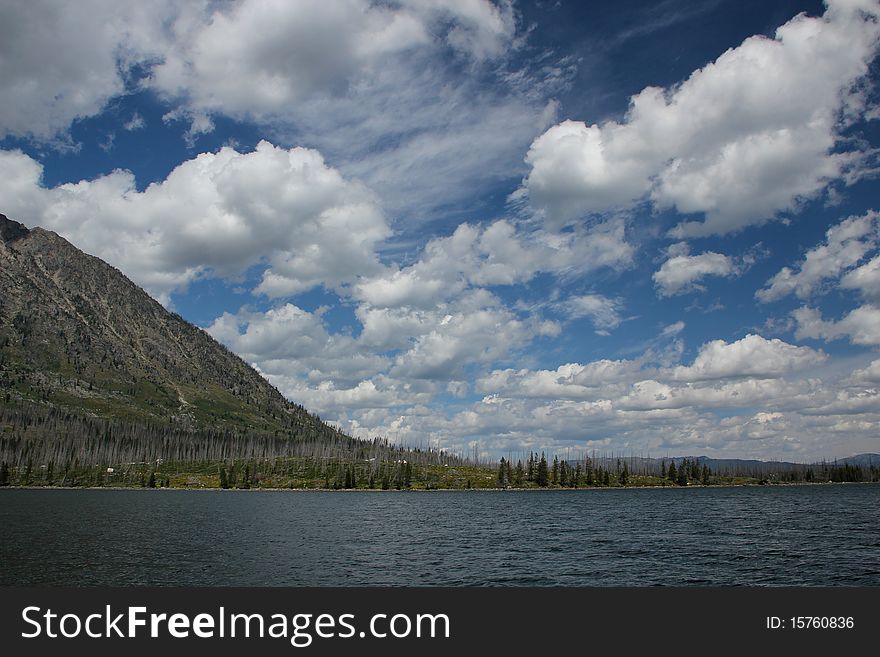 Clouds float above Jackson Lake and the Tetons. Clouds float above Jackson Lake and the Tetons