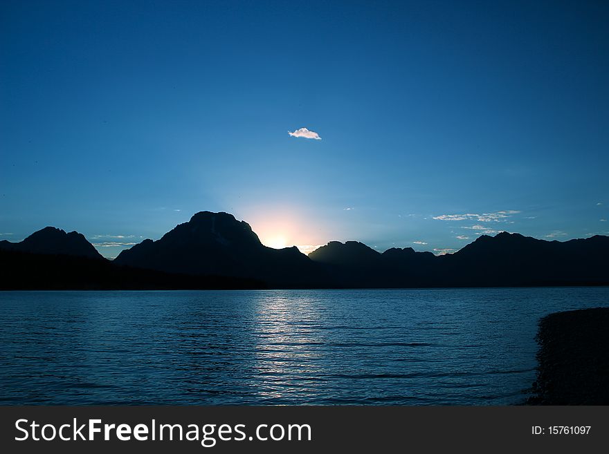 Beautiful sunset on Jackson Lake under the Grand Tetons. Beautiful sunset on Jackson Lake under the Grand Tetons