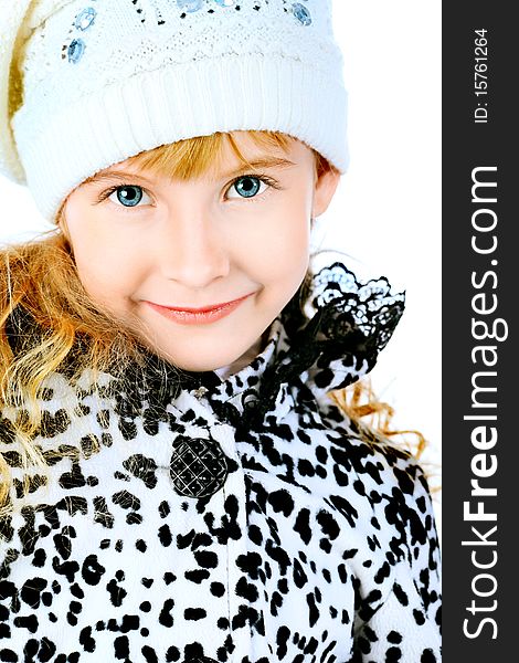 Portrait of a cute girl in a coat and cap. Isolated over white background. Portrait of a cute girl in a coat and cap. Isolated over white background.