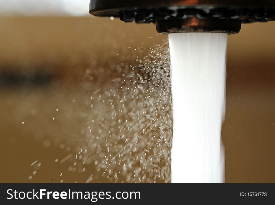 Water flowing out of the kitchen faucet