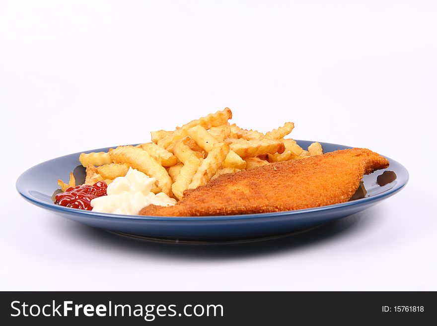 British cuisine: Fish and chips with ketchup and mayonnaise