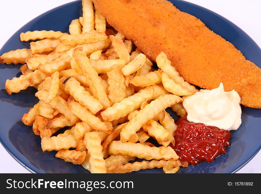 British cuisine: Fish and chips with ketchup and mayonnaise