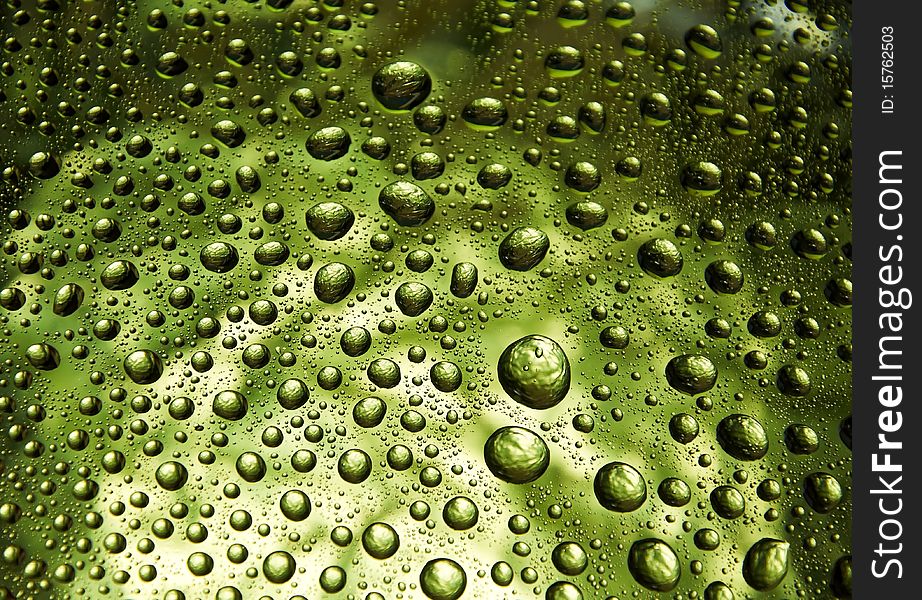 Many little water drops on the glass(yellow). Many little water drops on the glass(yellow)