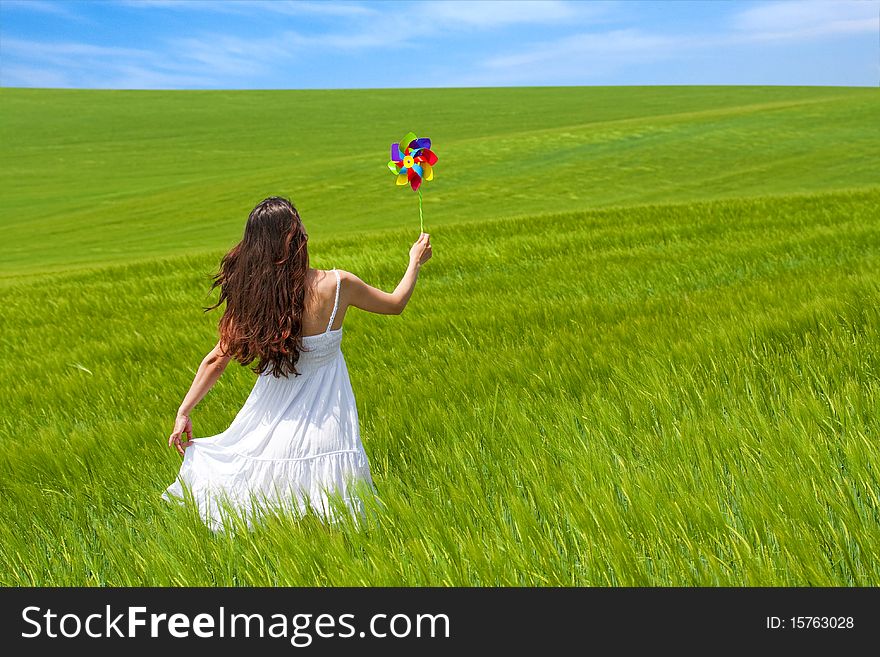 Girl in a green field, enjoying nature. Girl in a green field, enjoying nature