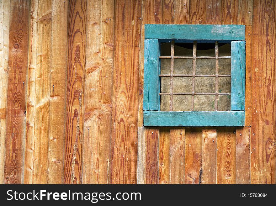 Closed window on an old wooden wall. Closed window on an old wooden wall