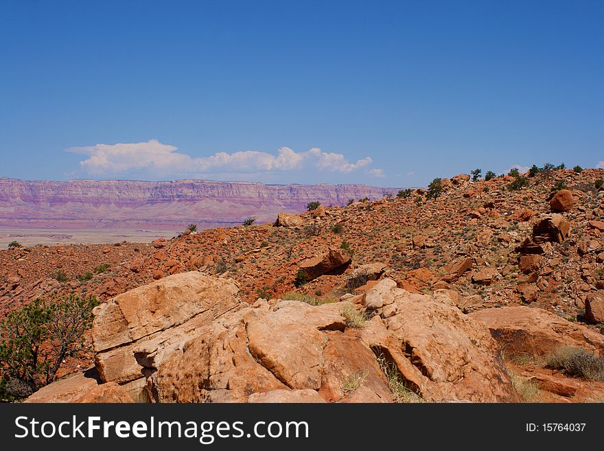 A mesa in the distance across the desert.