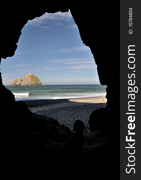 Oregon Coast Rocks seen from Cave with dog. Oregon Coast Rocks seen from Cave with dog