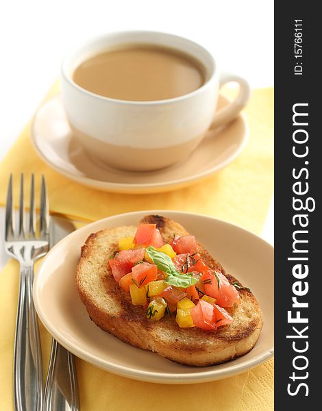 Bruschetta with salsa and a cup of coffee with milk