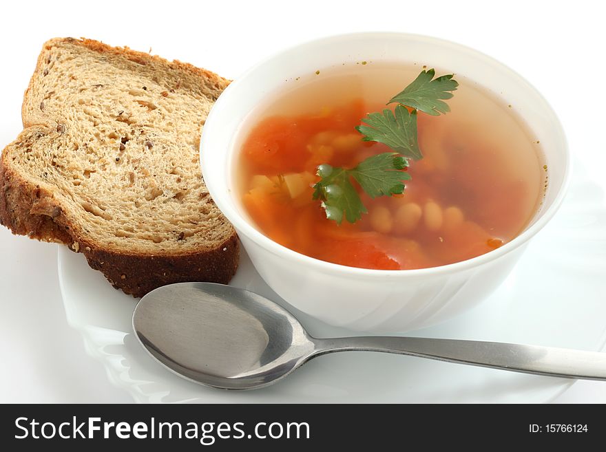 Bean soup with parsley and cereal bread. Bean soup with parsley and cereal bread