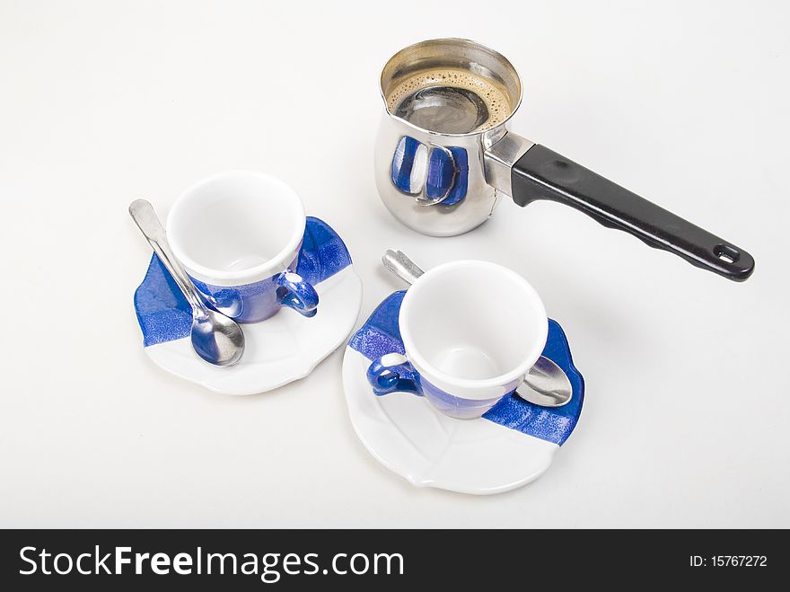 Two empty cups and pot of coffe