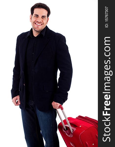 Young man standing with travel bag on an isolated background. Young man standing with travel bag on an isolated background