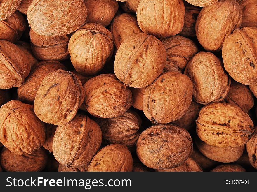 Textured background of walnuts close-up. Textured background of walnuts close-up