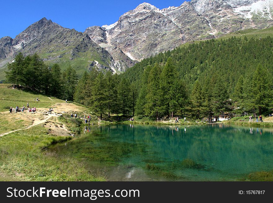 A view of green lake in the italian alps