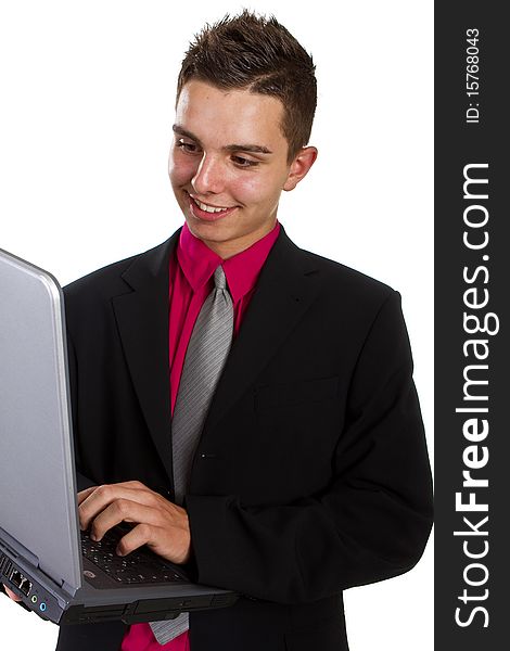 Young teenage businessman with laptop over isolated white background. Fresh young man with pink shirt.