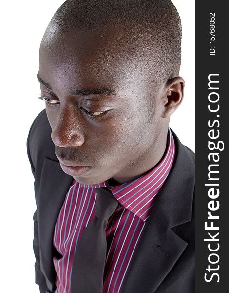 Young black businessman over white background. Isolated fresh teenager in suit.