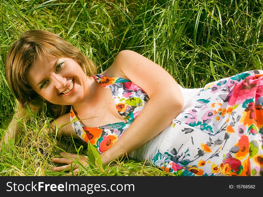 Beautiful girl relaxing on a meadow. Beautiful girl relaxing on a meadow