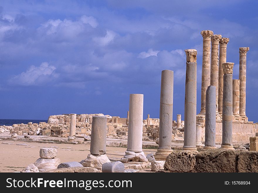 A ray of sunlight illuminates some columns in the archaeological site of Sabrata. A ray of sunlight illuminates some columns in the archaeological site of Sabrata
