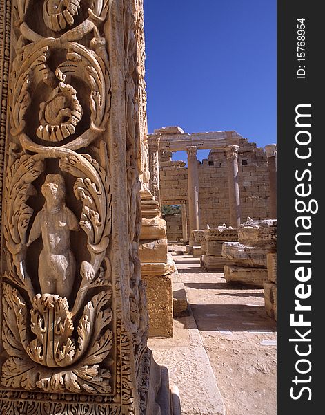 Details of some bas-reliefs in a column at the Severi Forum in the archaeological site of Leptis Magna. Details of some bas-reliefs in a column at the Severi Forum in the archaeological site of Leptis Magna