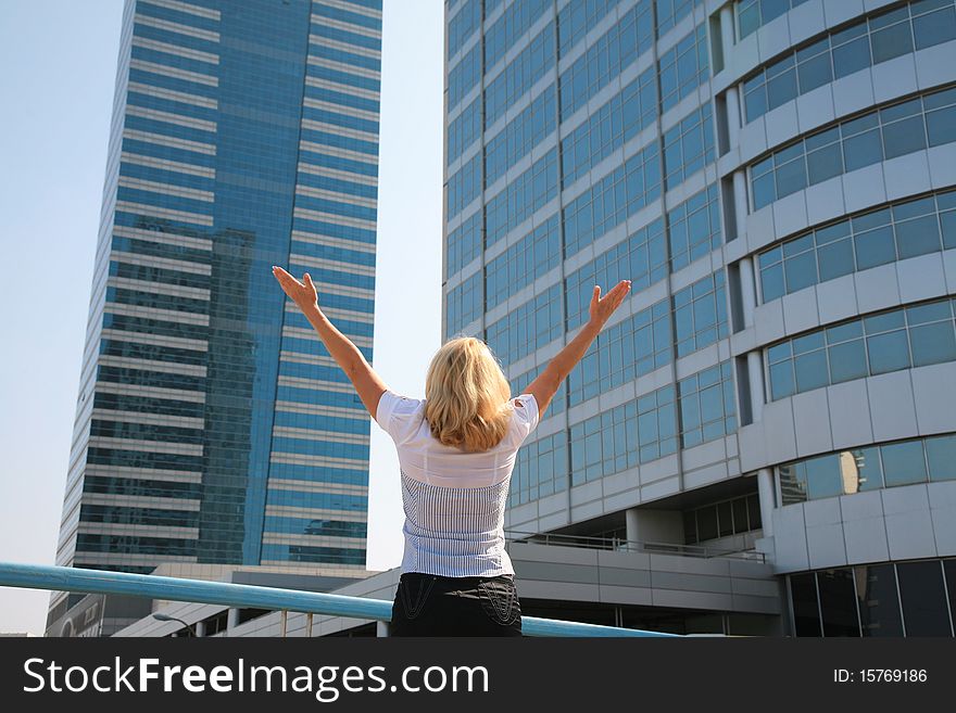 Business Woman Standing Against A Background Of Buildings