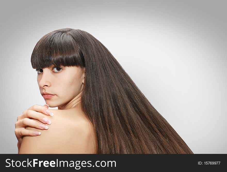 Front view of young beautiful woman's face with healthy fresh clean skin