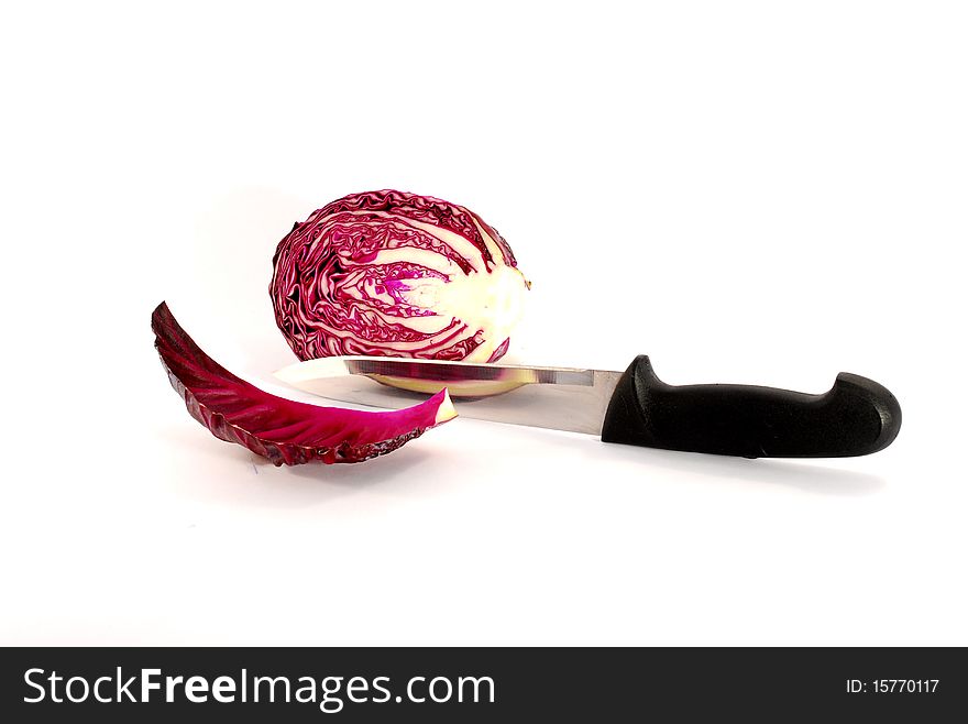Red cabbage sliced whit kitchen knife on white background. Red cabbage sliced whit kitchen knife on white background