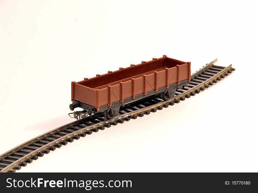 Brown toy truck on shaped railway